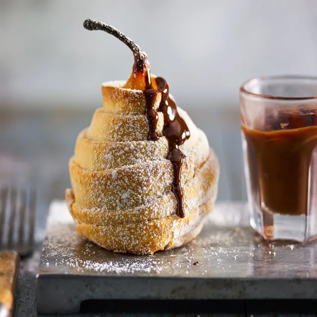 Whole pear pie with chocolate sauce - Better Homes & Gardens Australia