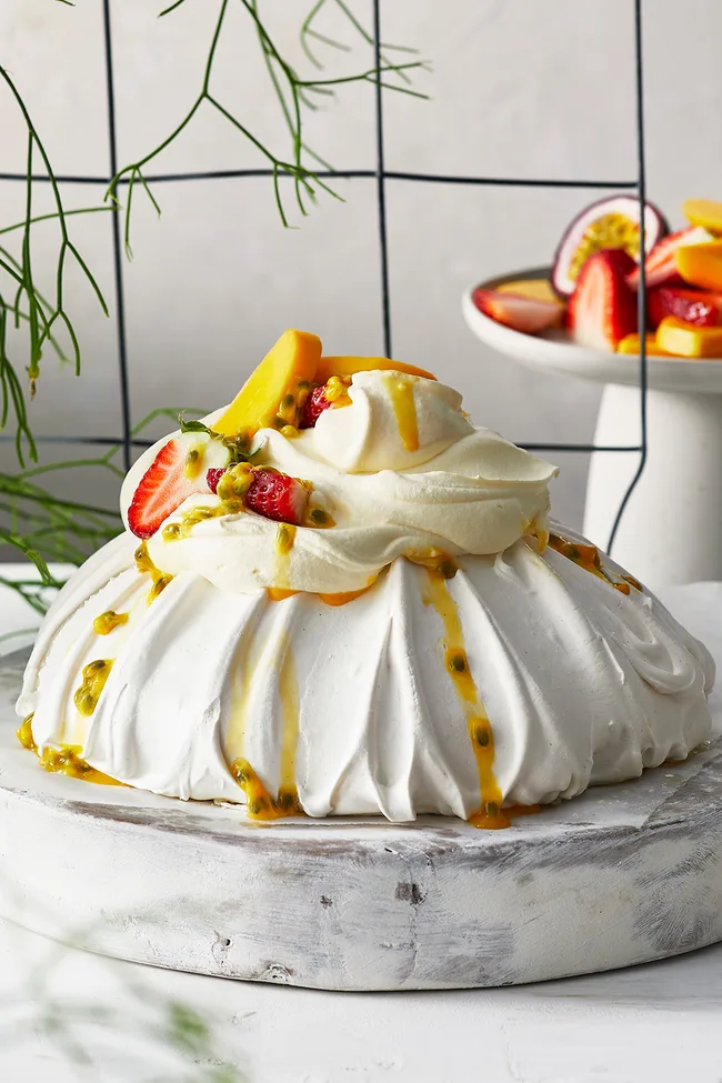 Pavlova with summer fruits and passionfruit drizzle