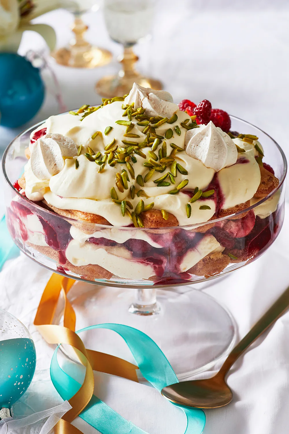 Berry tiramisu with pumpkin seeds, strawberries and cream on top 