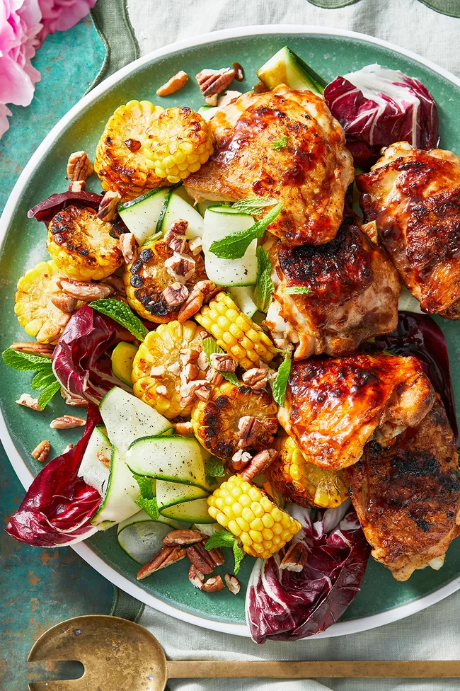 glazed barbecue chicken in bowl with corn