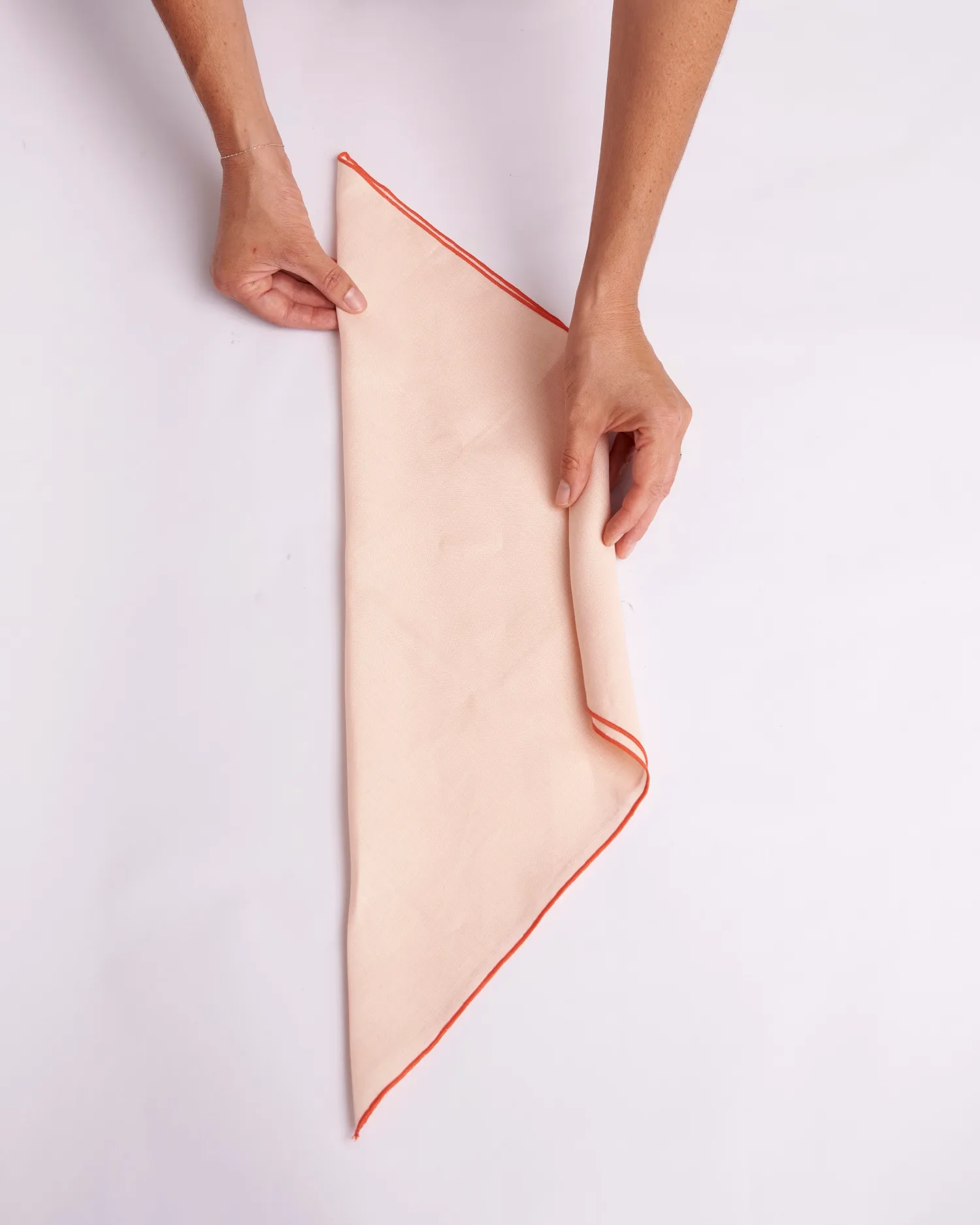 Fold napkin in half to create a triangle.