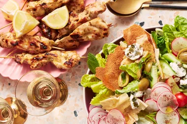 Chicken skewers with fattoush and green olive dressing