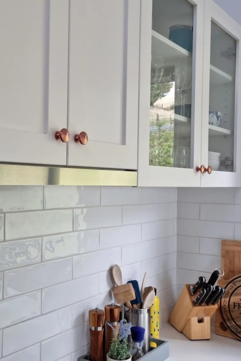 A cost-effective way to upgrade kitchens can include repainting existing cupboards and handles to give them a new look.