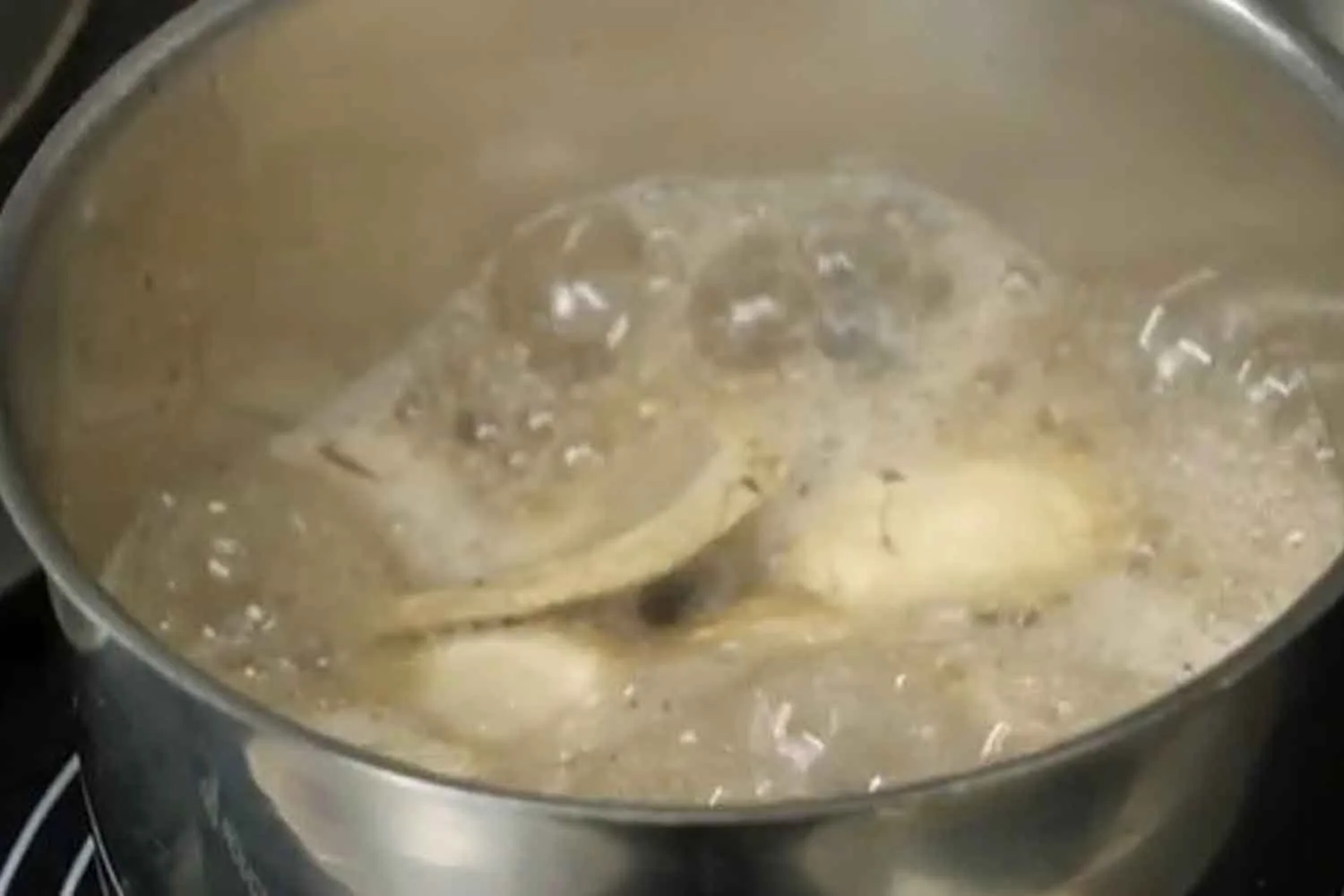 boiling mushrooms in a pot