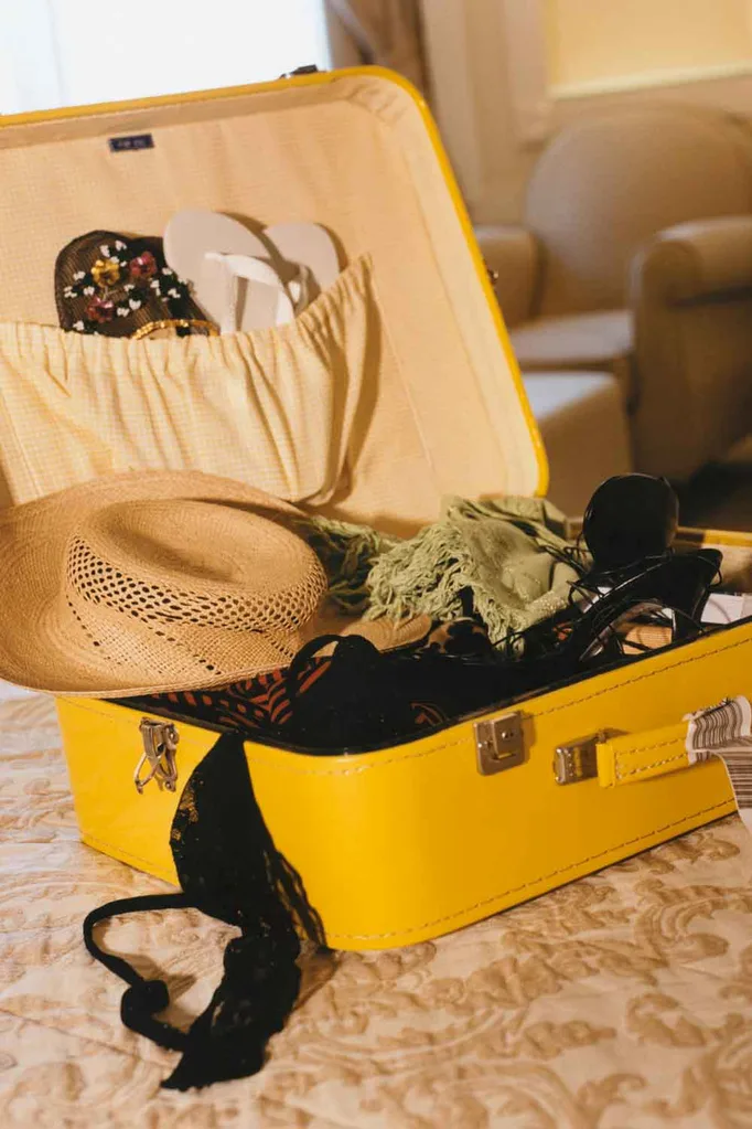 suitcase on bed in hotel
