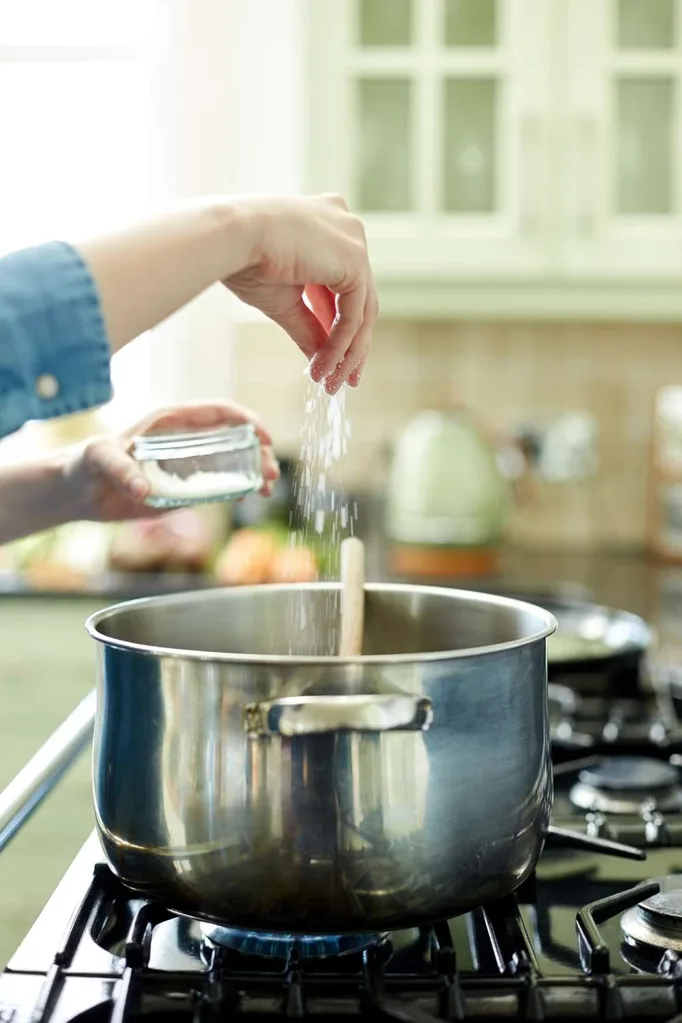 cooking with salt in a pot on a stove