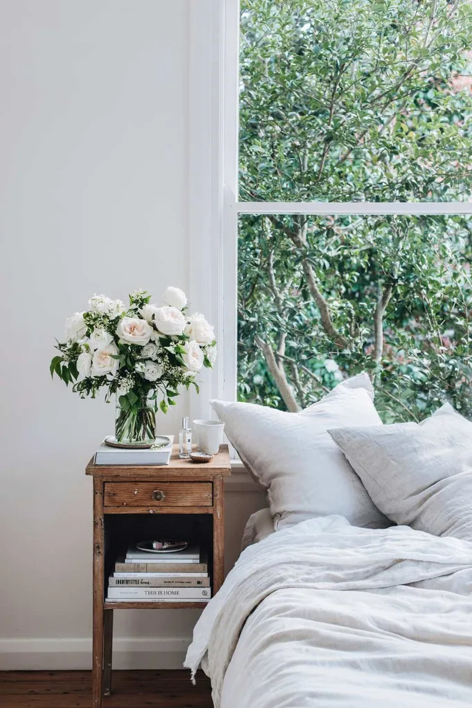 how to style a bed under a window