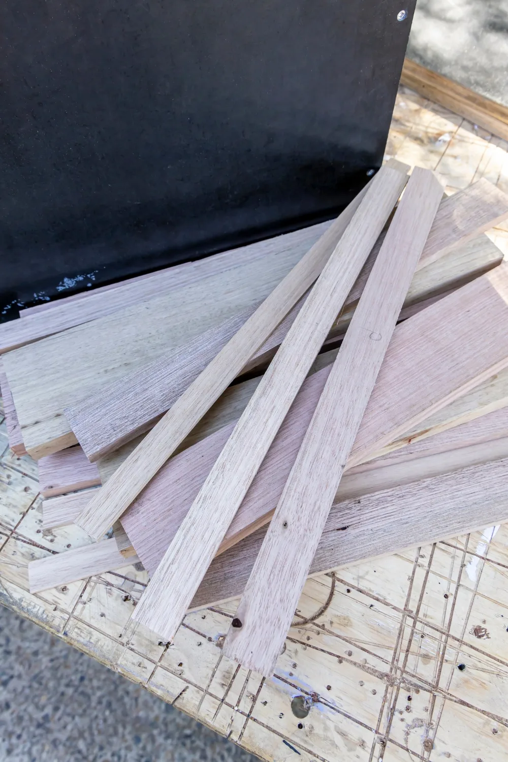 Put on disposable gloves. Use paintbrush to apply stain blocker as a whitewash to sides and front faces of oak cladding pieces. Wait 20 seconds, wipe off excess with lintfree cloth. Allow to dry. Repeat to whitewash all raw timber edges on doors and carcass. Dab all screws too.