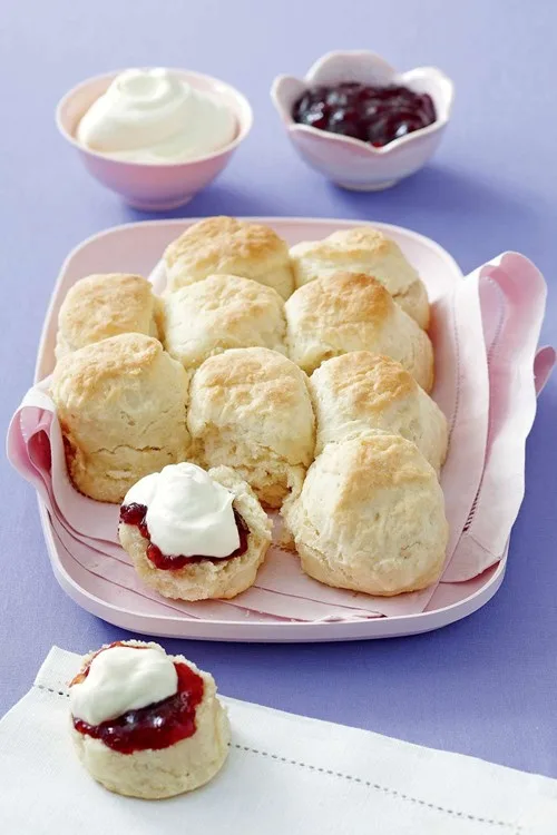 lemonade scones in pink container with purple table underneath