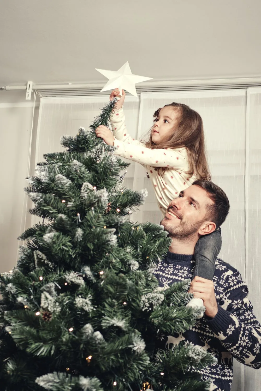 star-placed-on-christmas-tree
