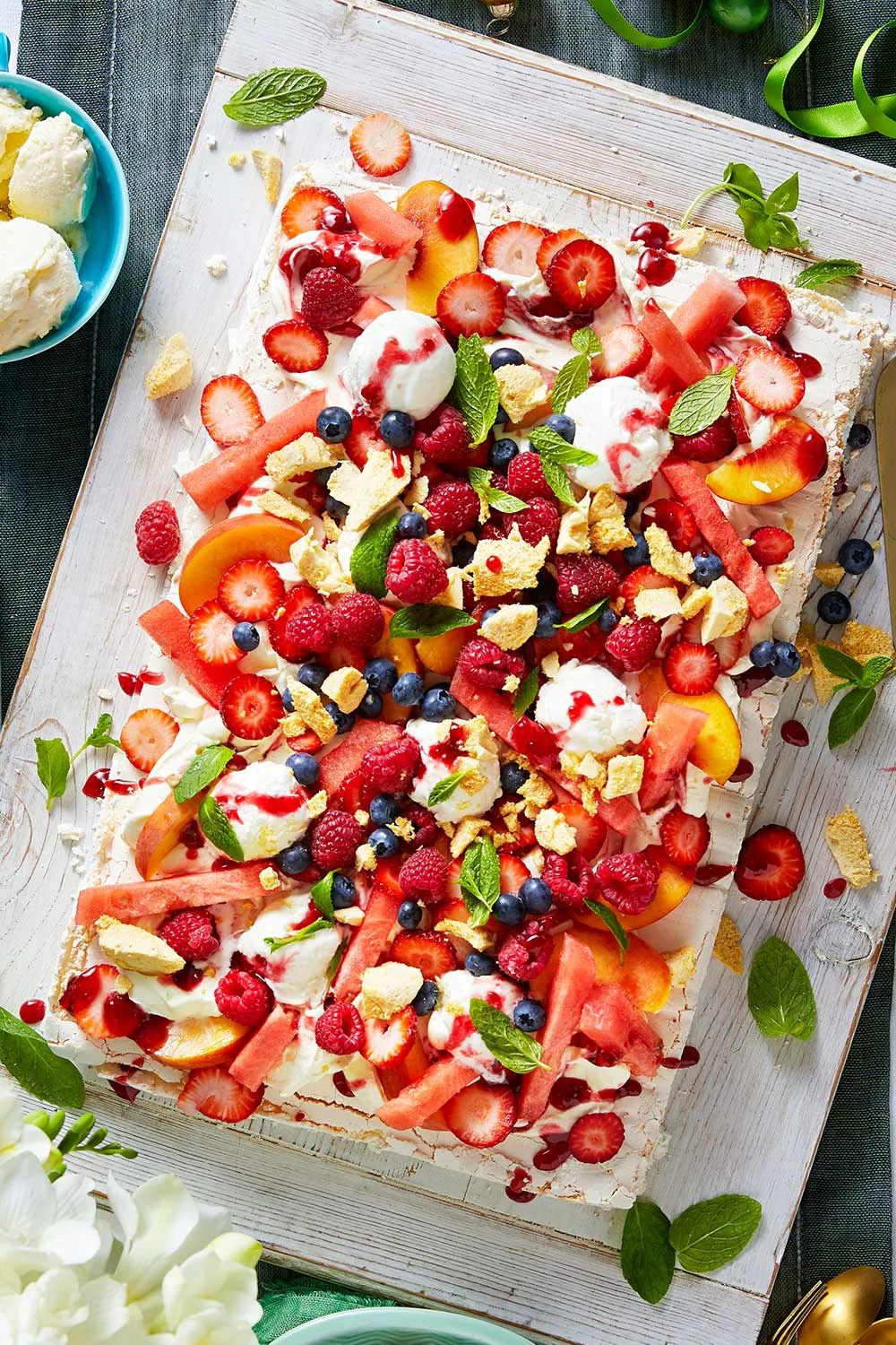 Easy pavlova with crushed honeycomb and lots of fruit on the top