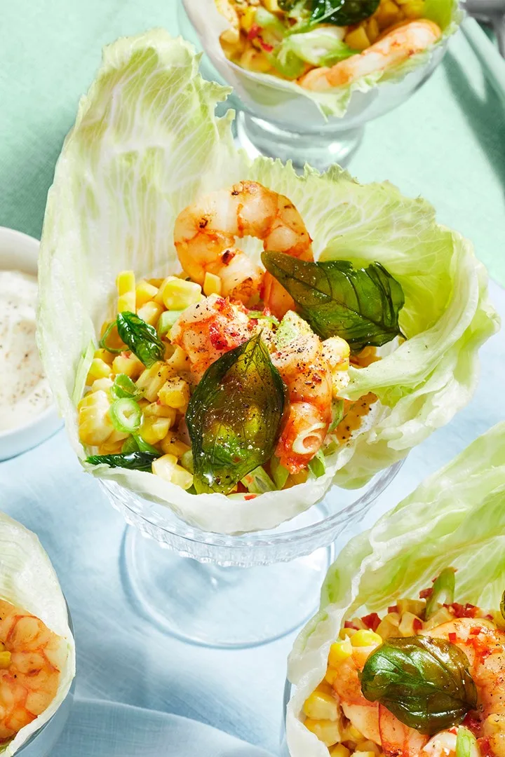 prawn cups in lettuce with crispy leaves and corn salsa