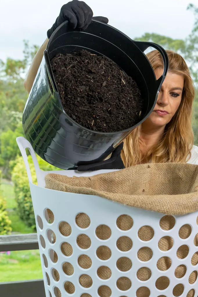 step 4 melissa fills the planter with potting mix
