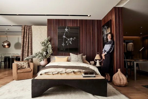 brown bedroom with bed in the middle