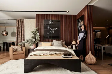 brown bedroom with bed in the middle
