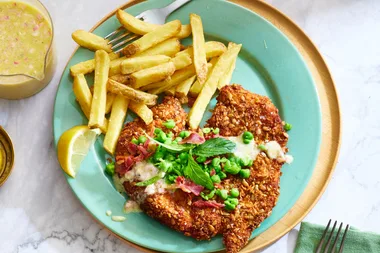 Seed and corn crumbed chicken with crisp bacon and mint pea buttermilk dressing