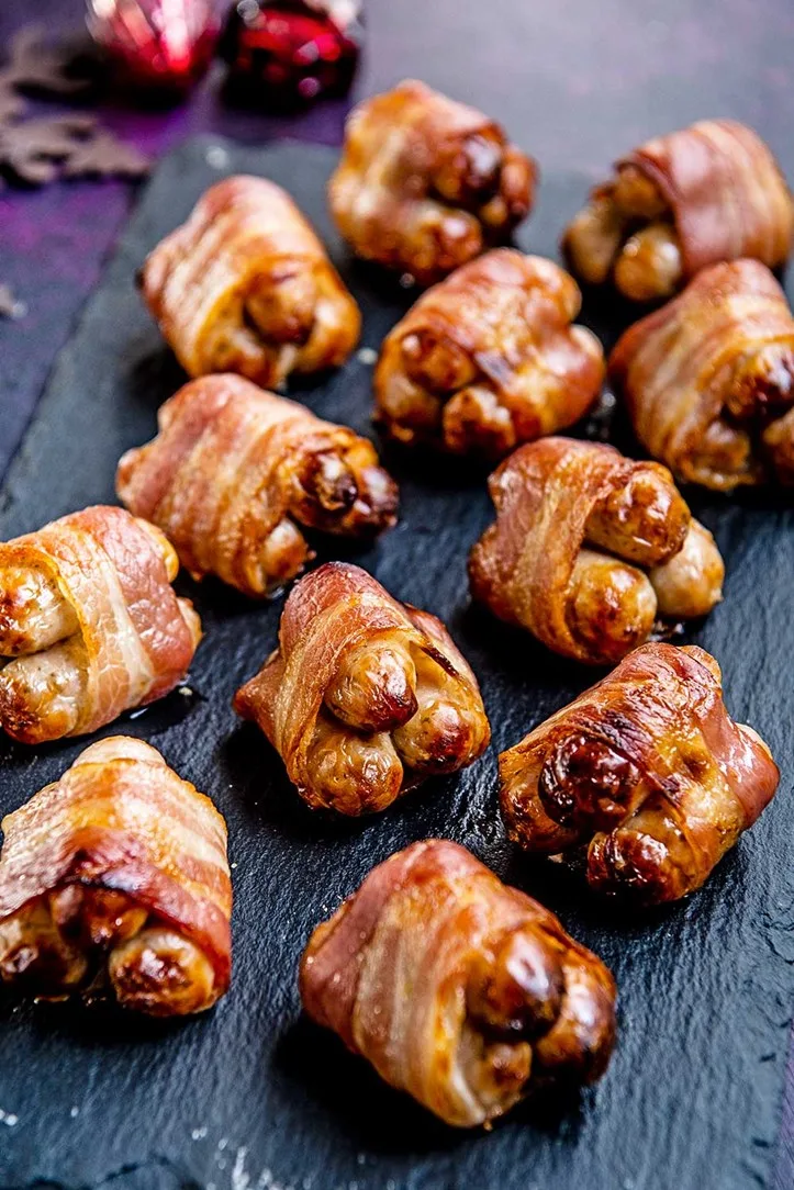 pigs in blankets on black tabletop surface