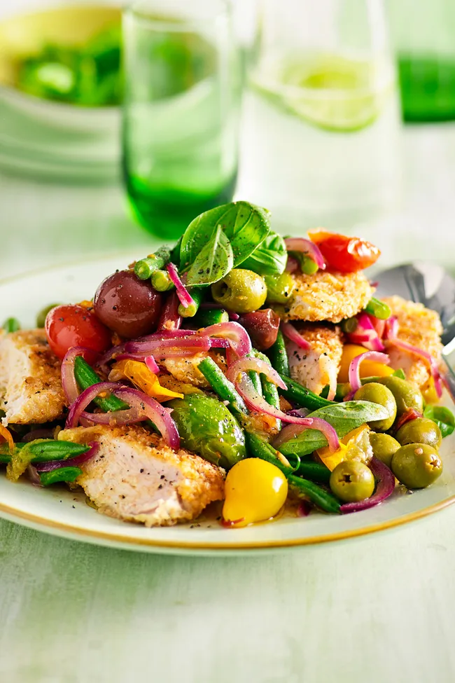 chicken schnitzel rainbow salad idea for dinner in light green bowl