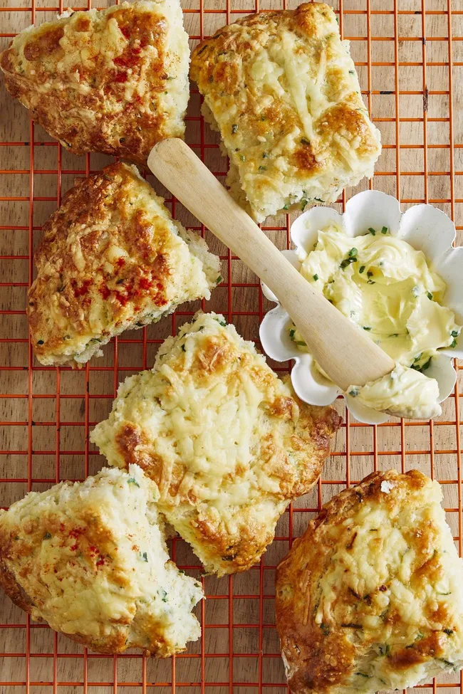 savoury scones with butter and wooden spoon