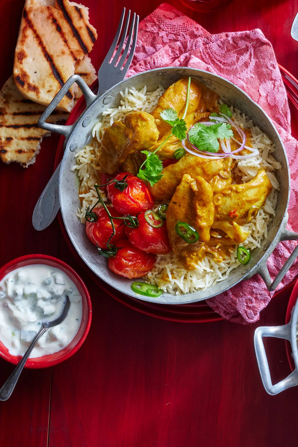 chicken tikka in bowl on bed of rice