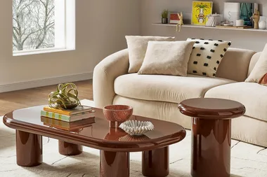 A beige couch and wooden tables from Castlery.