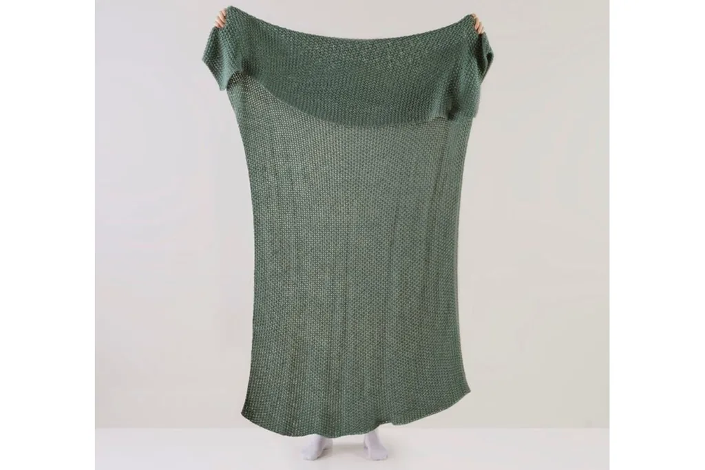 hallstatt lilypad blanket from adairs person holding up for size