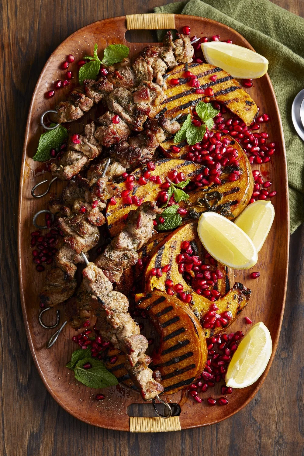 colins sage and pork skewers on plate with pumpkin salad