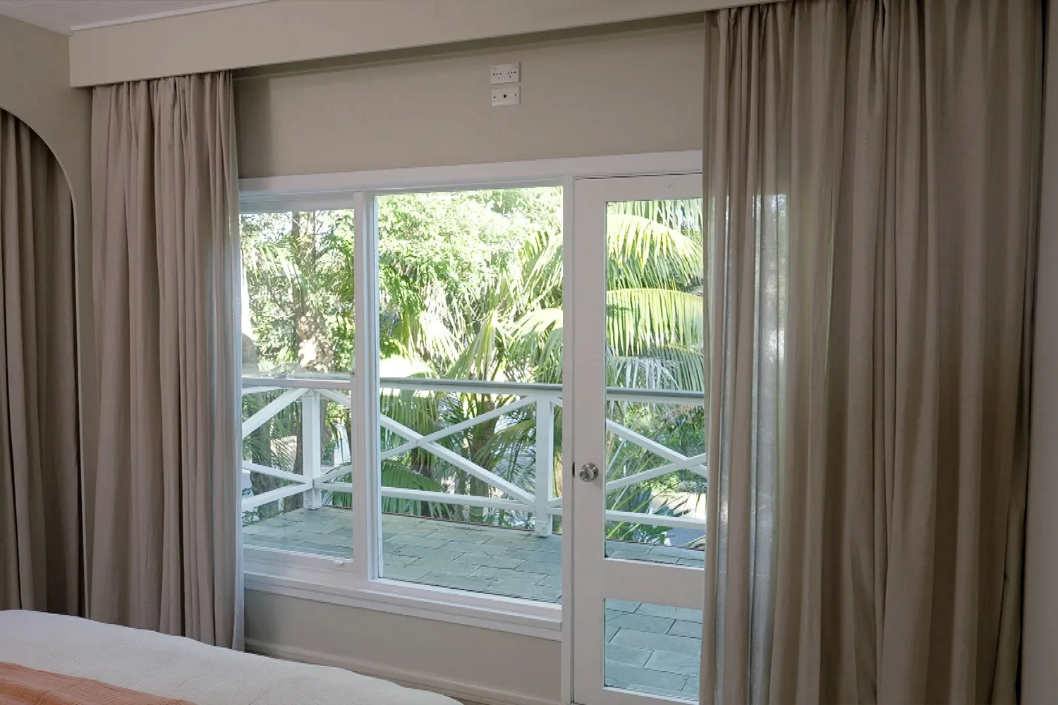 Juliet balances light and dark when hanging curtains