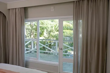 Juliet balances light and dark when hanging curtains