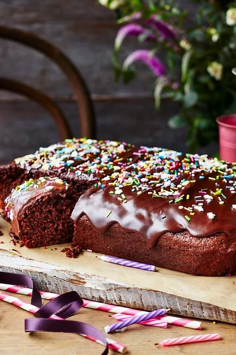 chocolate cake tray bake covered in sprinkles