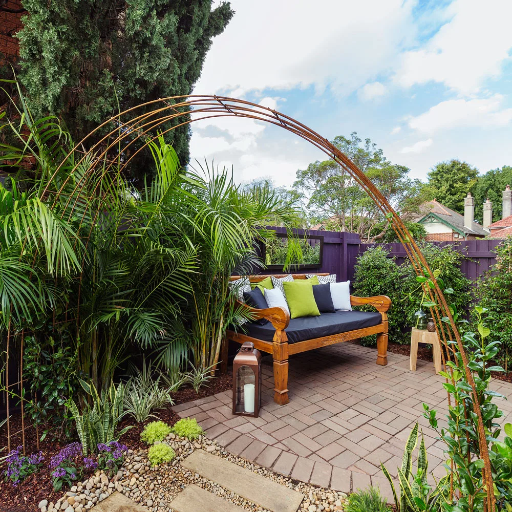 This DIY metal arbour helps create a sense of space in the garden, and is perfect for climbing plants.