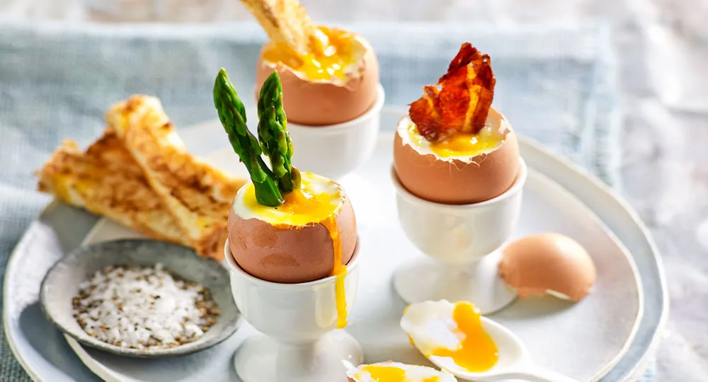 Runny eggs with soldiers