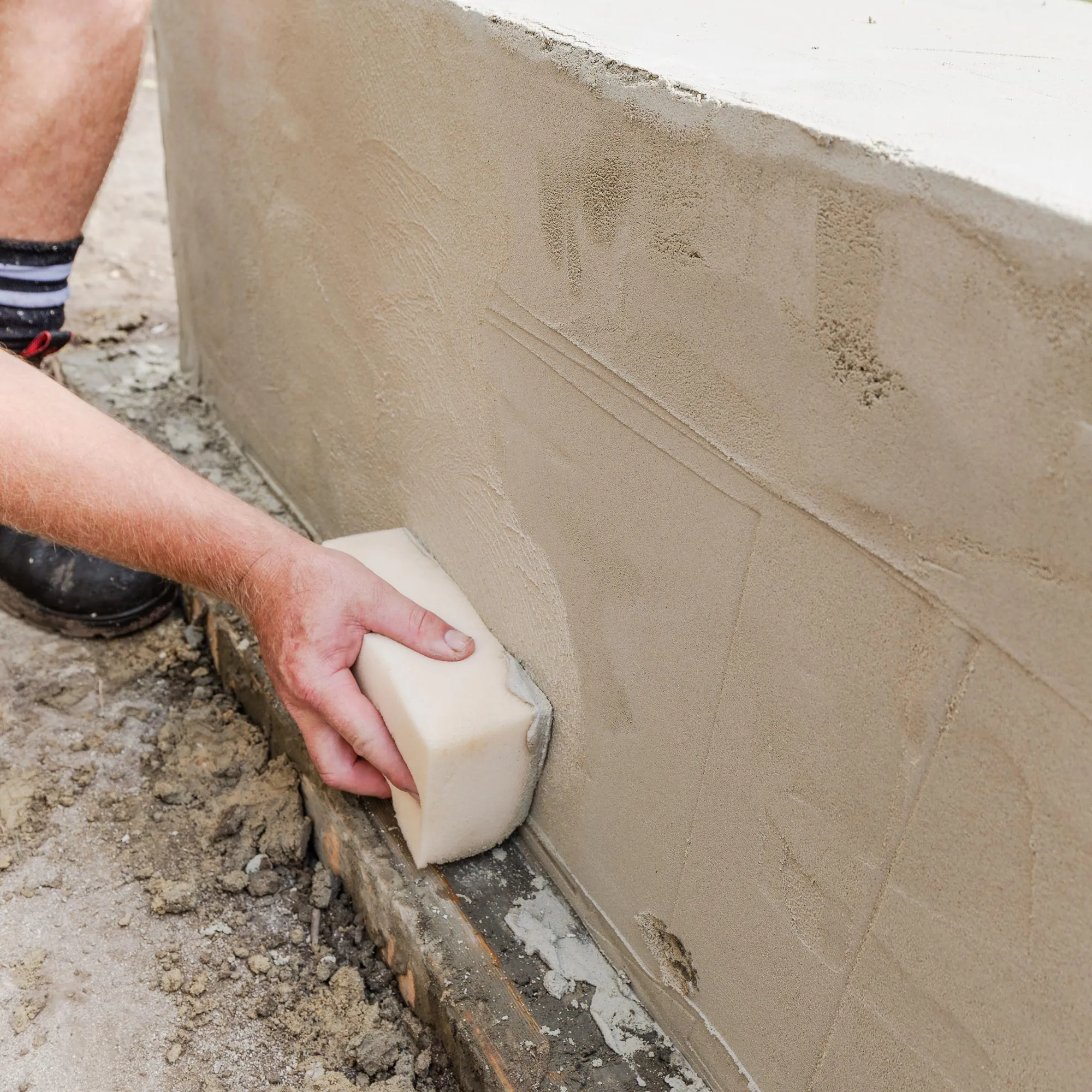 Step 8: Smooth surface with a damp sponge and leave render to cure for 7 days.