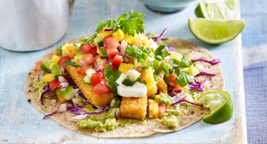Crispy fish tacos with smokey raspberry barbecue sauce and mango salsa