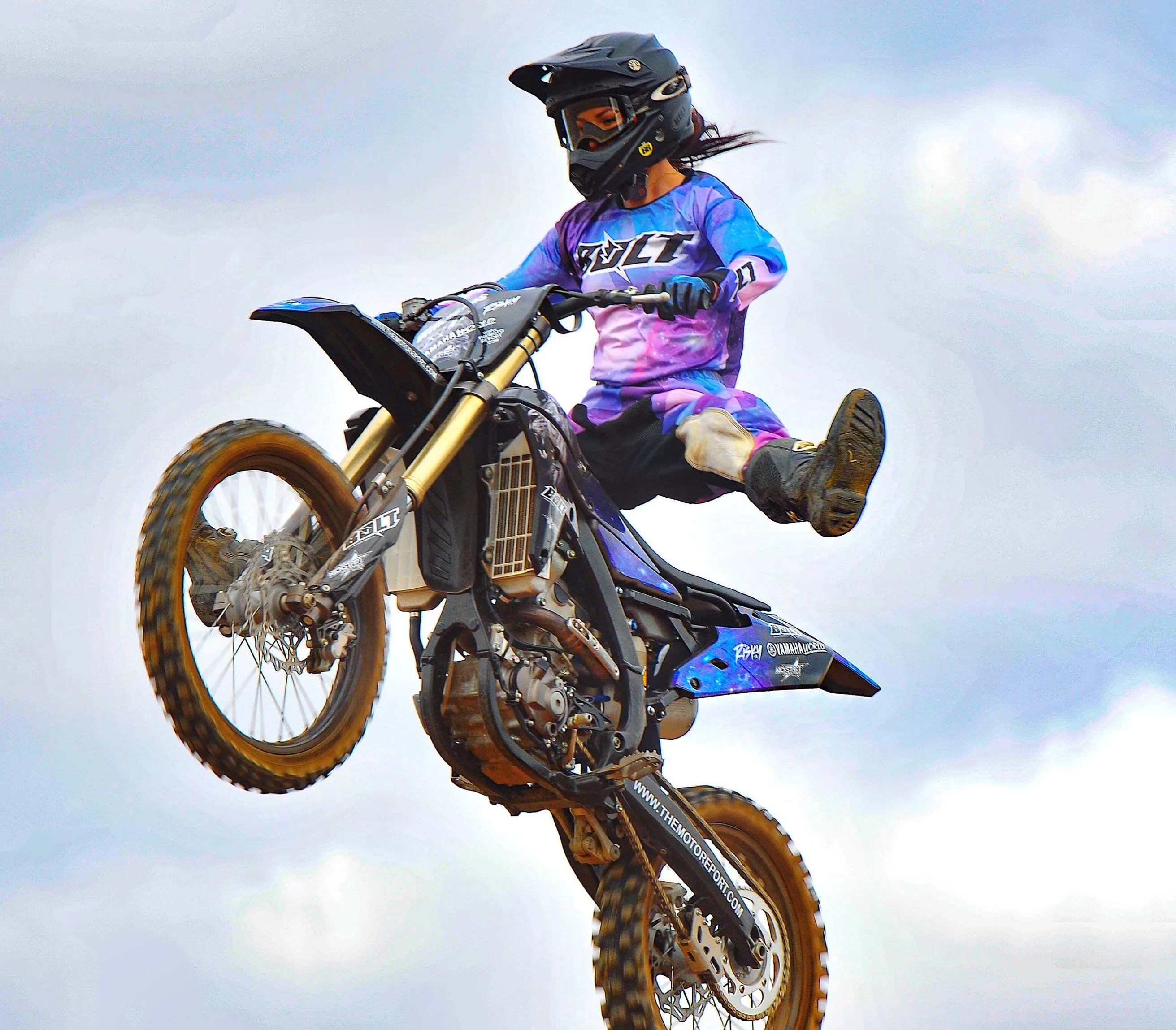 Semi-professional motocross rider making a jump