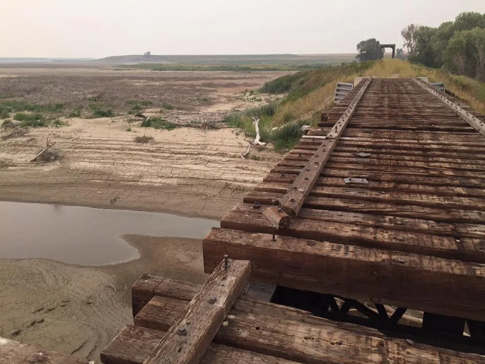 Photo of the abandoned train tracks bridge and resevoir