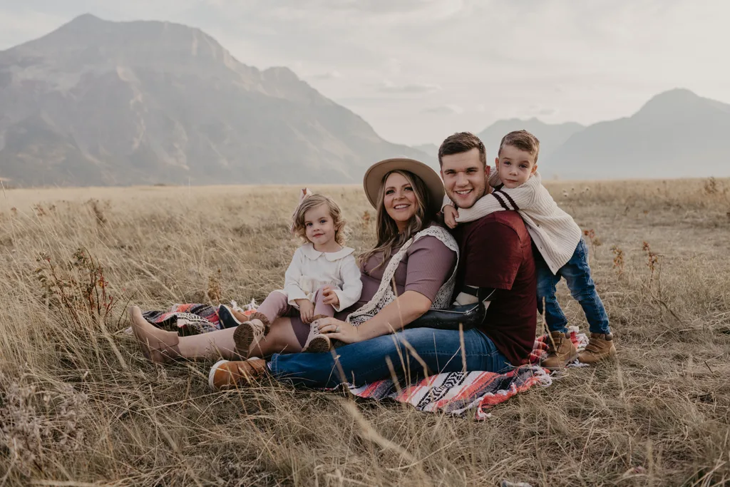 Photo of family, parents pictured with two children