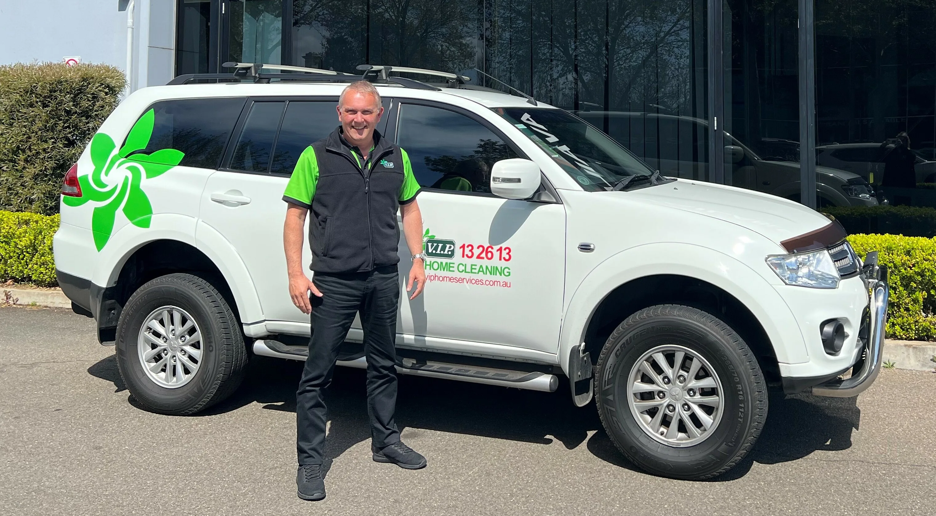 Man stands in front of work van