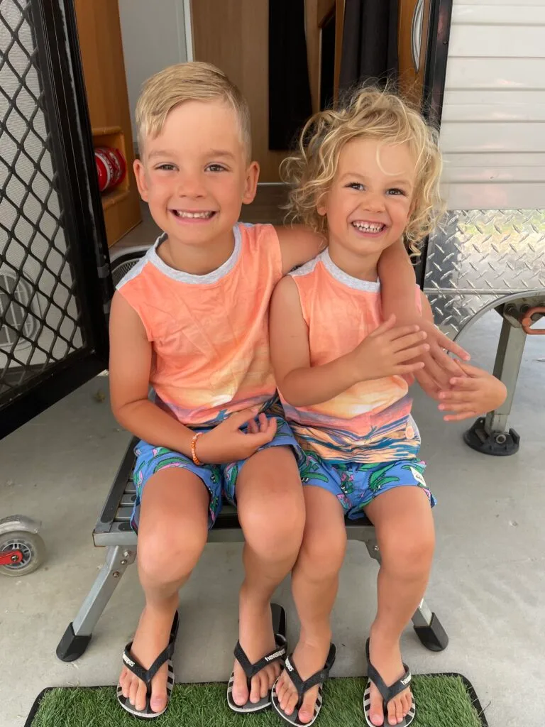 Picture of two young boys wearing matching orange shirts the day before the accident