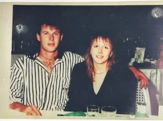 man and woman sat at table