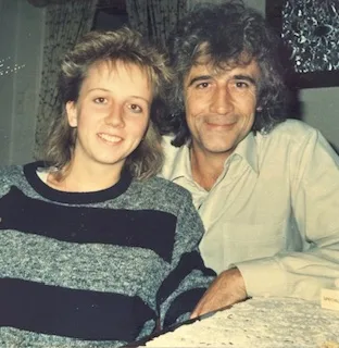Girl in a striped jumper and a man