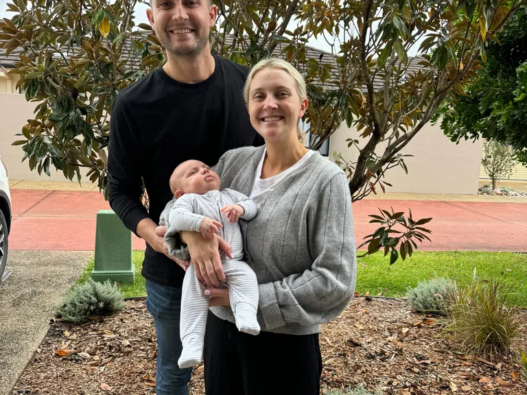 Picture of parents with their newboard son