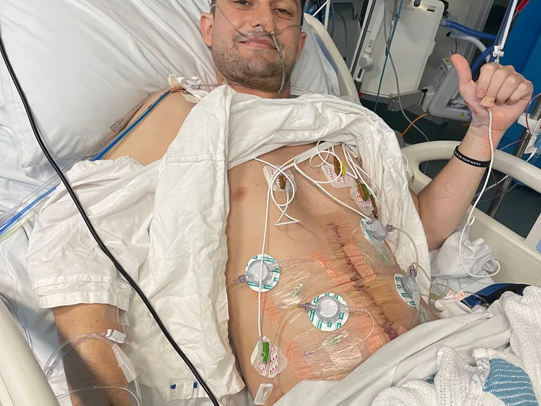 Photo of man recovering in hospital after surgery