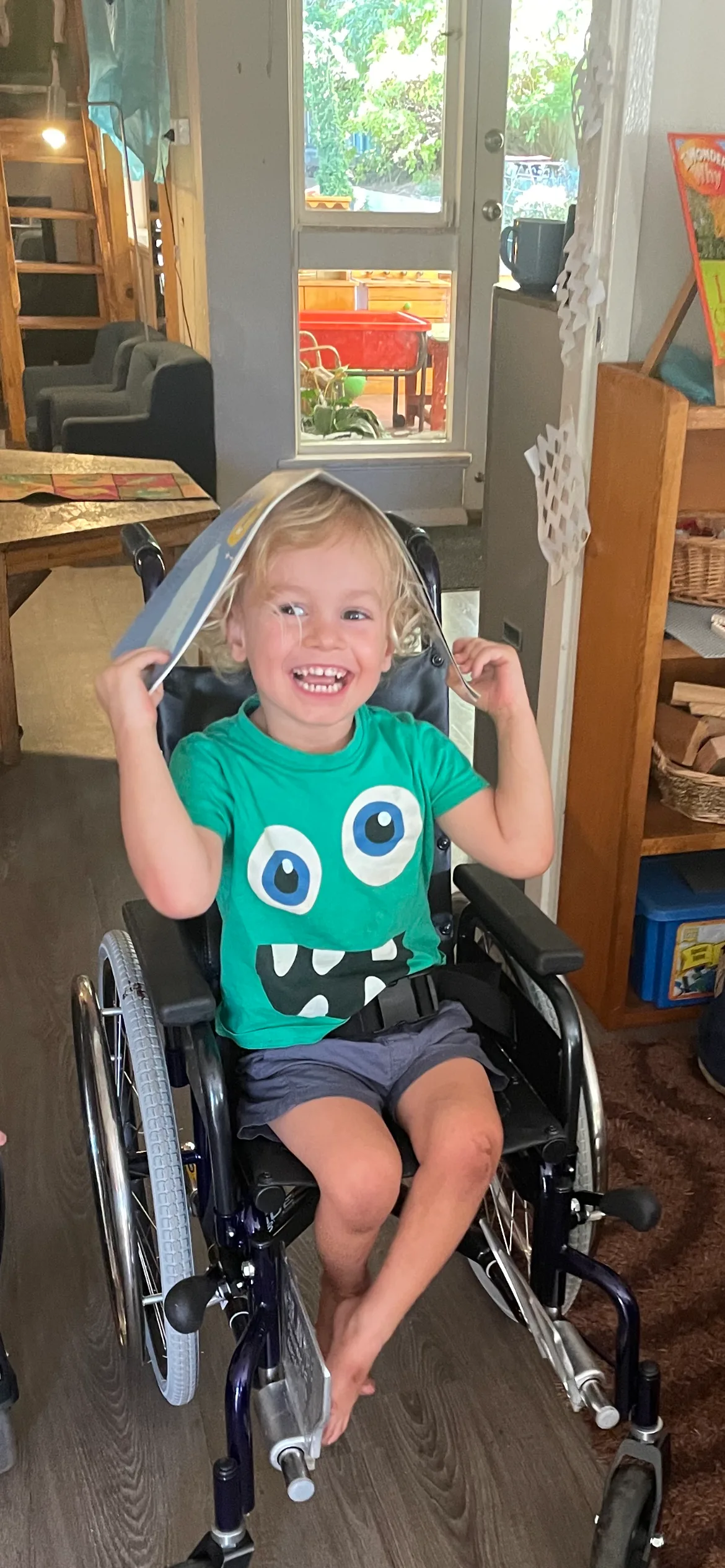 Photo of young boy sitting in a wheelchair