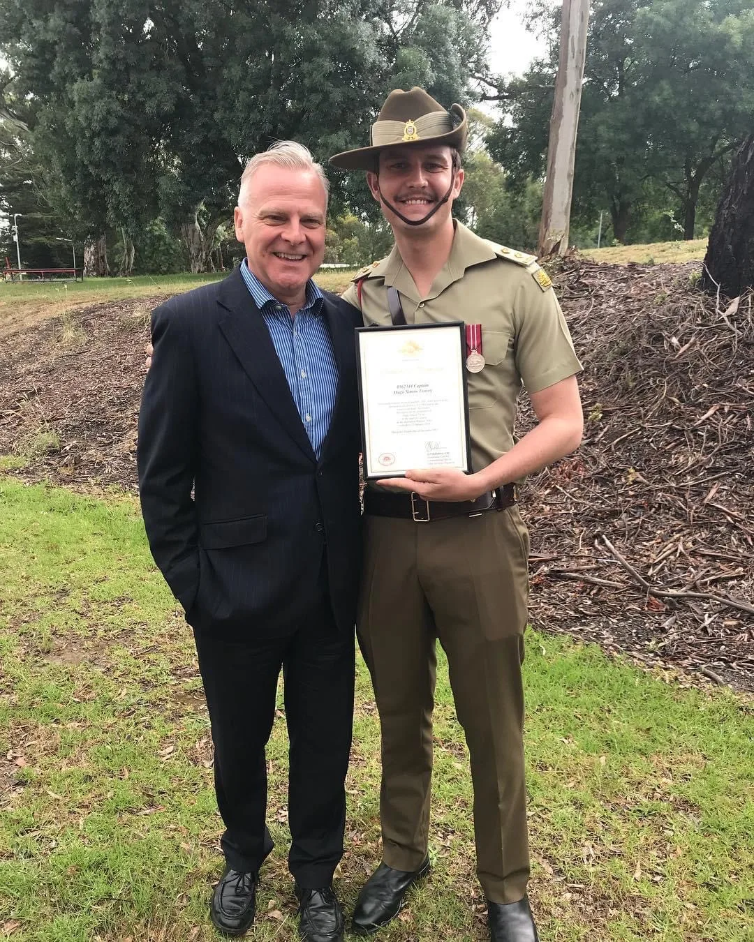 Photo of army soldier and his father