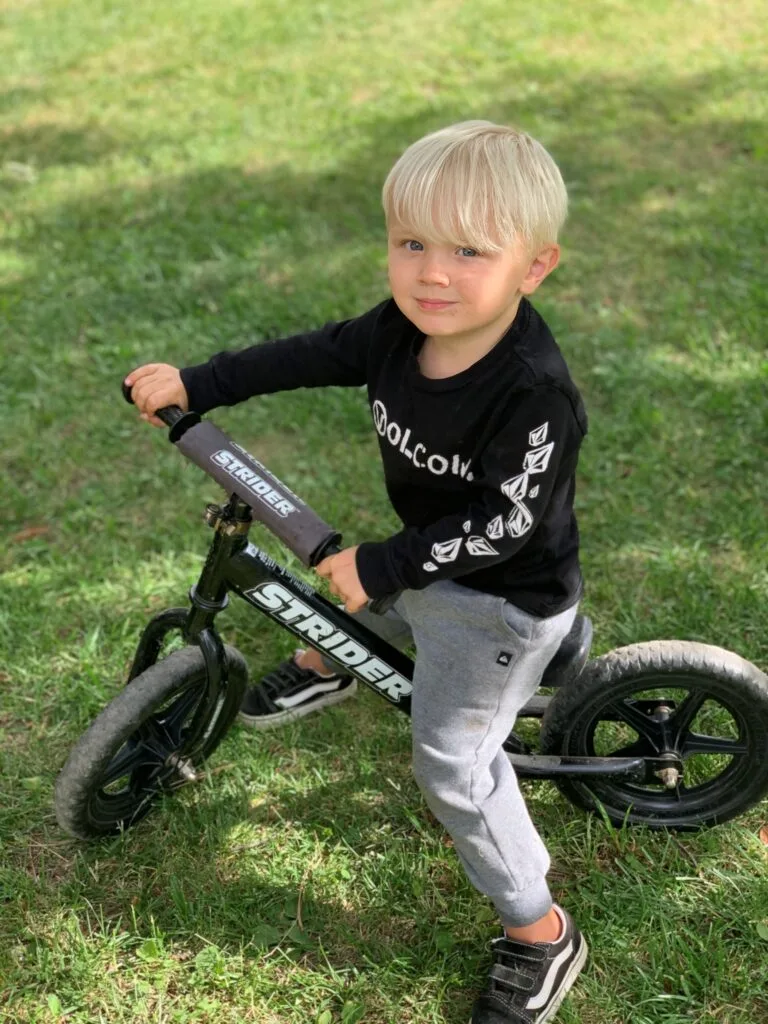 Photo of toddler riding a bike