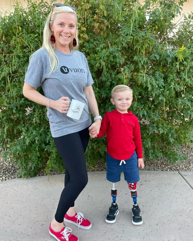 Photo of amputee toddler pictured with his mum