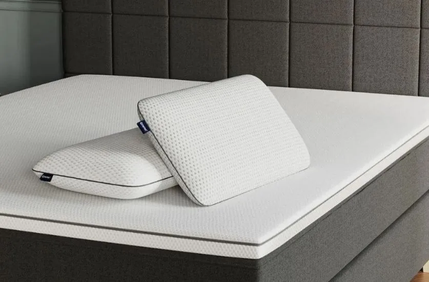 Emma foam pillows on a bare mattress with no pillow case