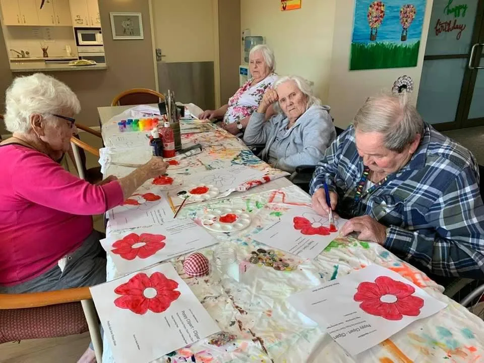 Image of Assisted living home residents doing arts and crafts