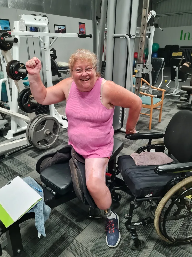 Image of woman working out at the gym with one leg